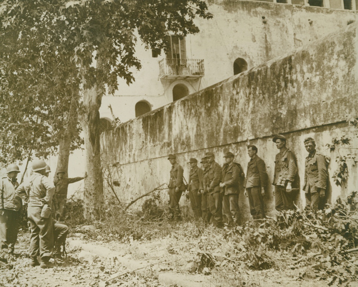 CAPTURED NAZIS IN ITALY, 6/7/1944. ITALY—A group of German prisoners line up against a wall before being questioned. The Nazi soldiers were taken with the Allied occupation of the Italian town of Terracina. Credit: Acme;