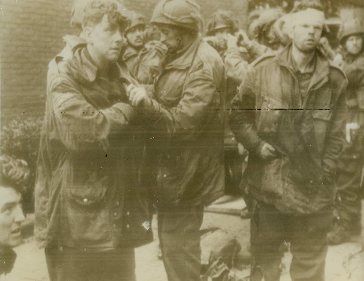 BRITISH PARATROOPERS CAPTURED AT ARNHEM, 9/28/1944. ARNHEM, HOLLAND—After nine days of holding out against superior German forces in the Arnhem pocket, these British paratroopers, members of the famed “Red Devil” squadron, were finally captured by the enemy.. Their faces clearly reveal the strain of the lengthy battle, when they fought with their small arms against the heavy guns of the Germans. Yesterday, the remaining paratroopers, 2000 of the approximate 8,000 who landed, were released from the trap by British 2nd Army forces. Almost 1,200 wounded were left behind and Germans say 6,400 were captured. Credit: Acme radiophoto;