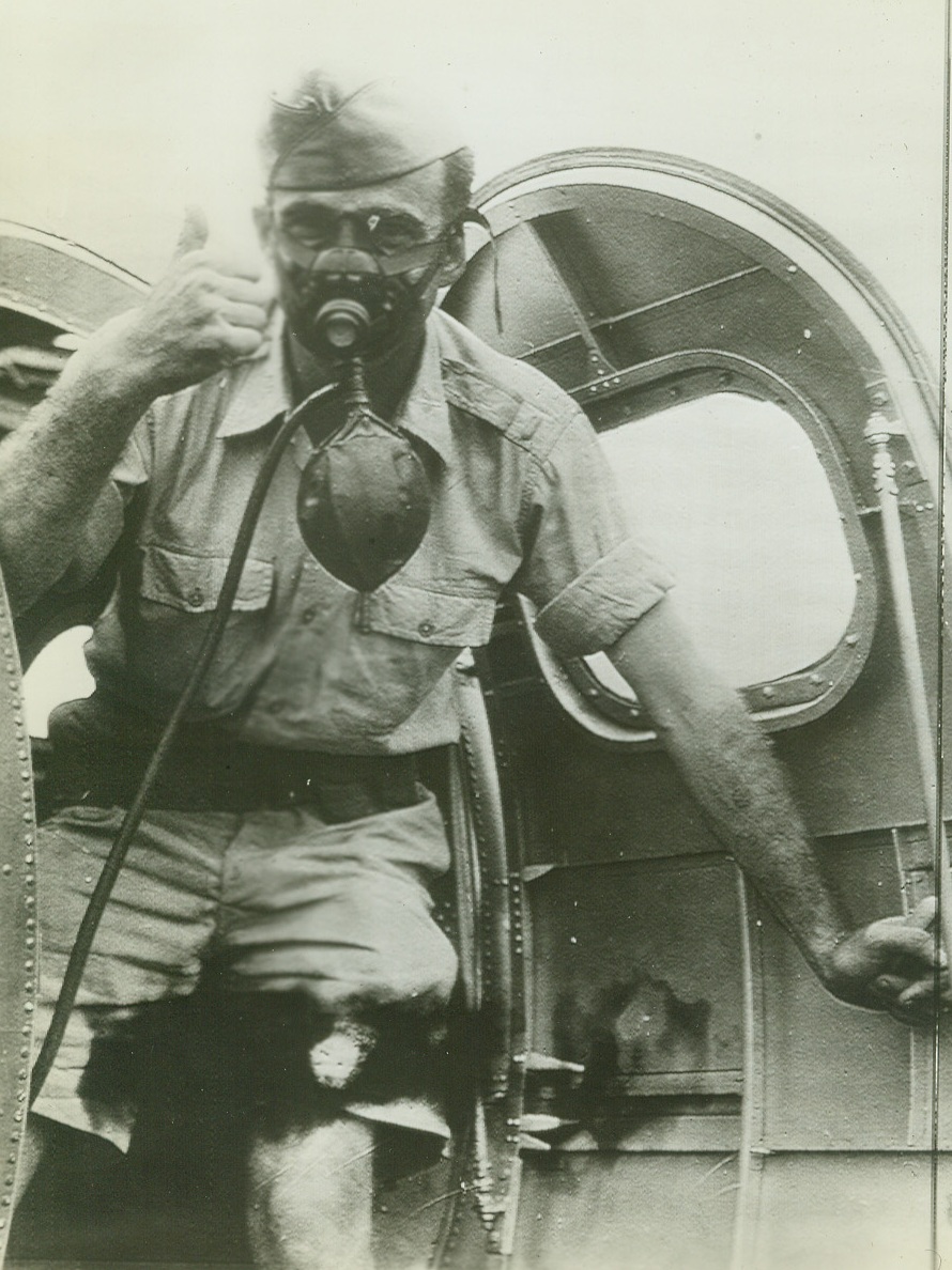 No Title. In one of the first pictures from Australia since U.S. entered war, a crew member of a U.S. Army Air Corps “flying fortress” wears his oxygen mask and gives “thumbs up” sign before taking off on flight. Now in Australia, the ship is one which was been in action against the Japanese in the Philippines.;